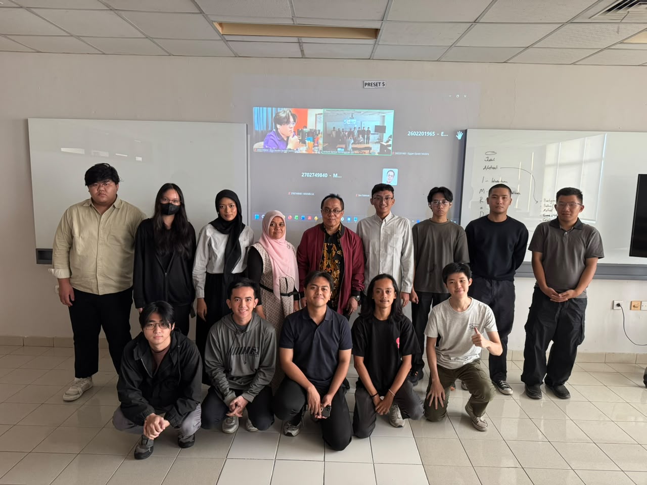 Dr. H. Benrahman with onsite participants while online participants join the BINUS University visiting lecture